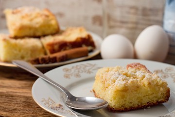 Fresh pie on white plate with spoon