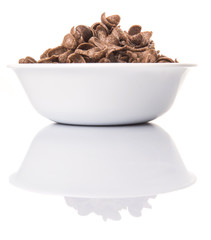 Crunchy chocolate breakfast cereal in white bowl 