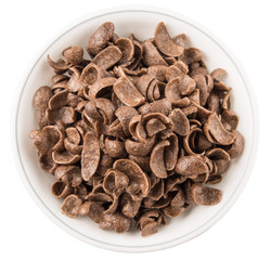 Crunchy chocolate breakfast cereal in white bowl 