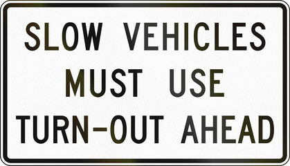 United States traffic sign: Slow vehicles must use turn out ahead