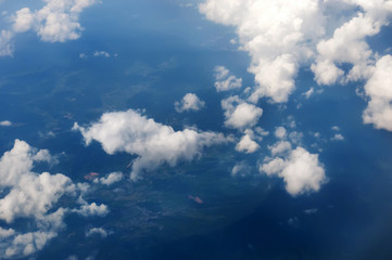 blue sky background with white clouds,from the airplane