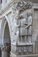 Fototapeta na wymiar Drunkenness of Noah - sculpture at Doge's Palace column, Venice