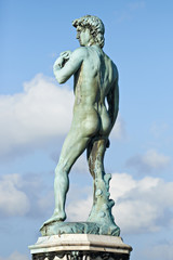 David (Michelangelo) on blue sky background, back view