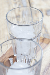 Two glasses with ice cubes