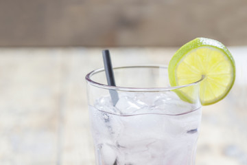 glass with ice cubes and lime