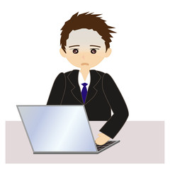 パソコンの前の男性