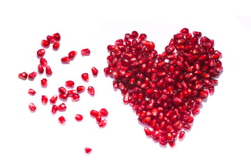 An image of a heart of pomegranate seeds