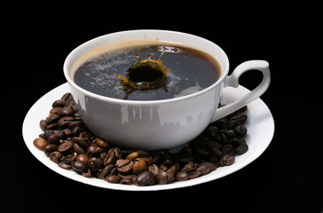 cup of coffee over black background