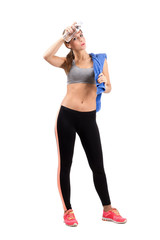 Tired gym woman cooling with cold water bottle