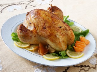 roasted chicken with  filling and vegetables for dinner