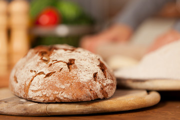 Fresh home made bread over wooden table