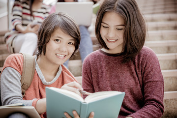 group of happy teen high school students outdoors