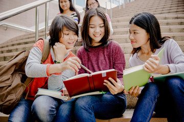 group of happy teen high school students outdoors