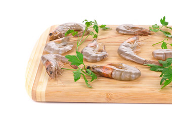 Fresh shrimps on wooden board
