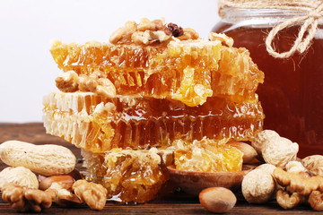 Honeycomb and honey on a wooden surface