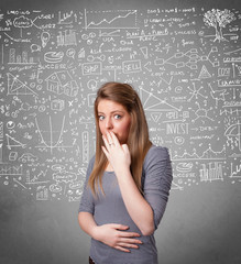 Fototapeta premium Young pretty lady with hand drawn calculations and icons