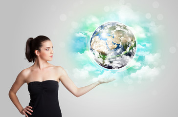 Young woman with earth and cloud concept