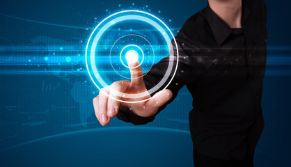 Businessman pressing high tech type of modern buttons