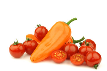 Fototapeta na wymiar fresh cherry tomatoes and two orange peppers (capsicum)