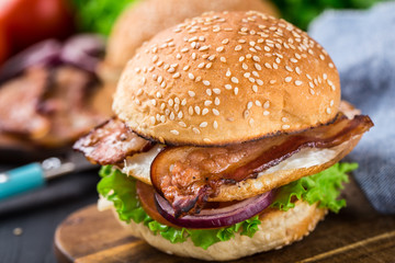 Home made burger on wooden board