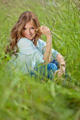 Fototapeta premium young beautiful woman , on green background summer nature