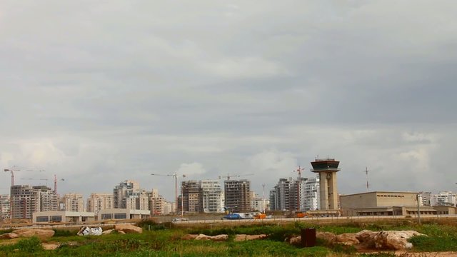 Sde Dov airport on modern Tel Aviv background