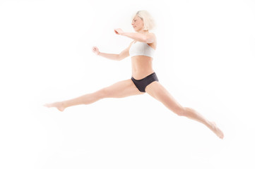 Fototapeta na wymiar beautiful young blonde in a jump
