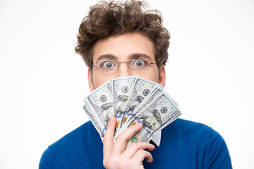 Handsome man with money over gray background