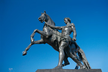 Fototapeta premium Sculpture of Horse Tamer, Anichkov bridge, Saint Petersburg, Rus