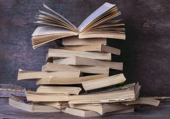 stack of books and open book
