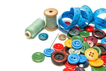 plastic buttons and spools of thread