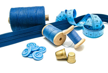 zipper, buttons and spools of thread