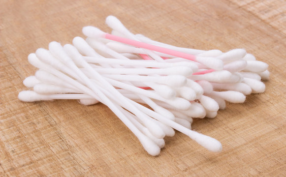 cotton buds on the wooden background
