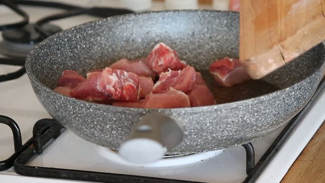 meat frying in a pan