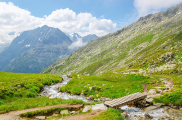 Fototapeta na wymiar Beautiful alpine landscape with a mountain brook