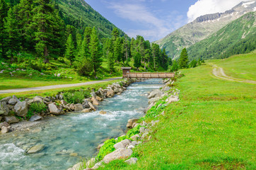 Mountain stream and the high peaks of the Austrian Alps - 79452554
