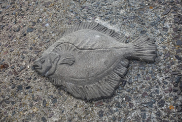 stone relief with flounder