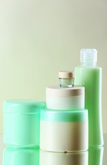 Cosmetic bottles on light background