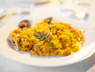 Close-up of spanish paella on the plate.