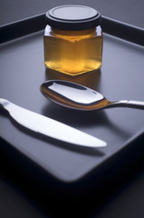 Studio image: cutlery and a jar of jam