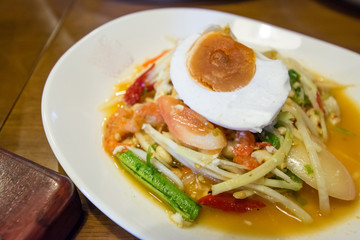 Thai papaya salad serve with vegetables