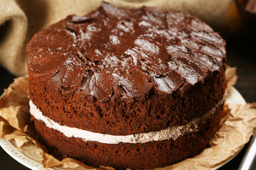 Delicious chocolate cake on table close-up