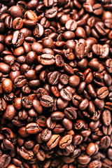 Brown coffee beans. Roasted coffee beans for background and text