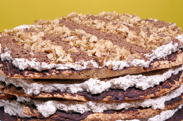 Meringue cake with nuts and chocolate.