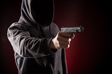 Naklejka premium Killer with gun close-up