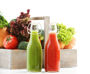 Glass bottles of fresh healthy juice with set of fruits and