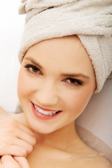 Woman relaxing in bathtub.
