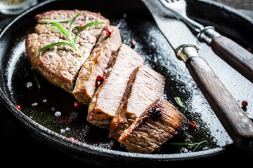 Hot meat with fresh herbs on plate