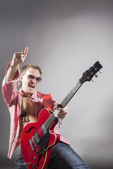 Fototapeta premium Music Concept: Portrait of Expressive Caucasian Male Guitarist P