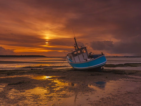 Fishing Boat Grounded At Low Tide In Poole Harbour